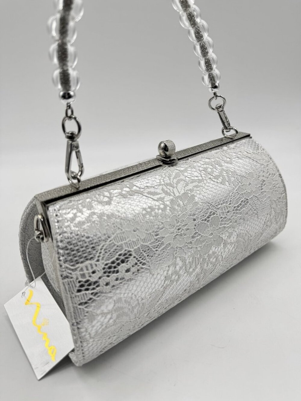 NINA Audra vintage-style floral lace clutch top handle bag in White / Silver
